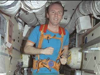 NASA-7 crewmember Andrew Thomas runs on the treadmill inside Mir's Kristall module. 